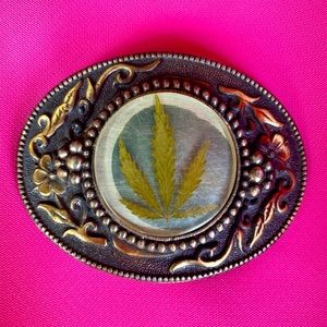Vintage belt buckle feat. cannabis cast in…